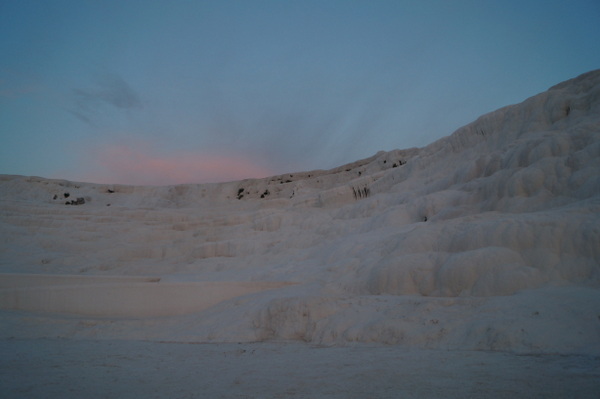 Pink sky over Pamukkale cliffs