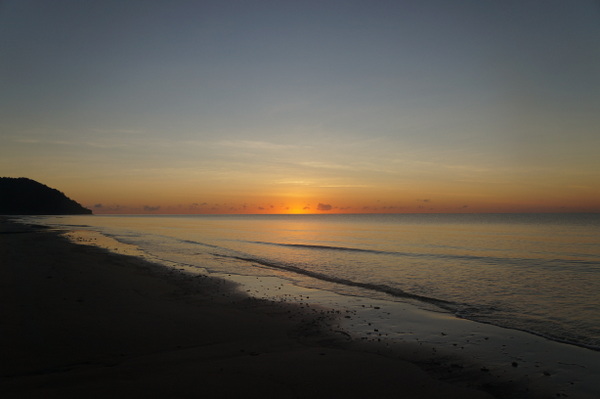 Sun rising over Cape Tribulation and Myall Beach