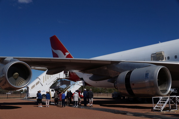 Tour group outside a 747 at the Qantas Founders Museum