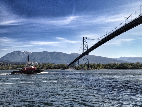 Tug boat about to go under Lions Gate Bridge